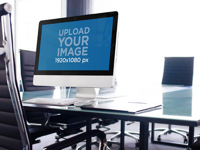 iMac in a Conference Room on Top of a Glass Table Mockup a4783