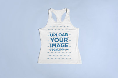 Sports Mockup of a Racerback Tank Top Lying Over a Surface