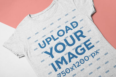 Closeup Mockup of a Tee Lying Over a Surface with Two Colors