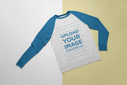Mockup of a Heathered Raglan Tee Over a Surface with Two Colors 
