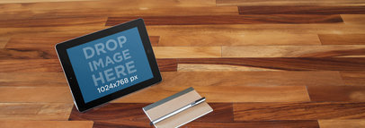 Mockup of an iPad on Top of a Wooden Table 