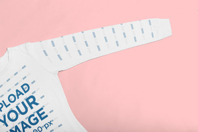 Closeup Mockup of a Long Sleeve Tee Over a Solid Surface
