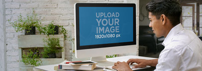 Young Latino Man at Home Working on his iMac Mockup