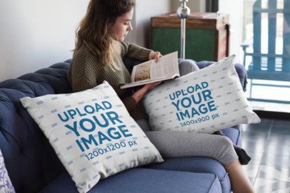 Mockup of a Woman Reading Next to Two Throw Pillows 23575