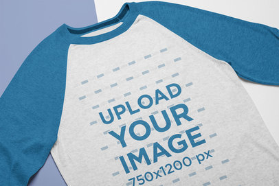 Mockup of a Crew Neck Heathered Raglan T-Shirt Lying on a Flat Surface