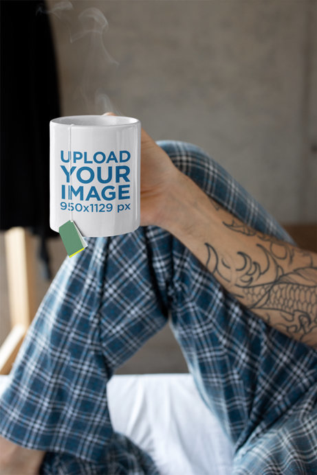 Mug Mockup Featuring a Tattooed Man in His Pajamas