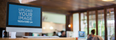 Mockup of an iMac at an Office Workspace