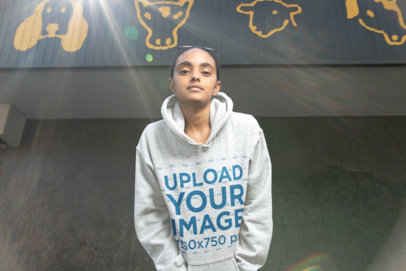 Heathered Pullover Hoodie Mockup Featuring a Beautiful Woman Looking to the Camera
