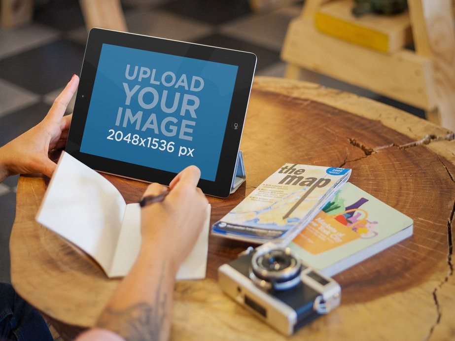 Young Woman at a Hip Coffee Shop Using an iPad Mockup 
