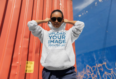 Heathered Pullover Hoodie Mockup Featuring a Trendy Woman with an Attitude