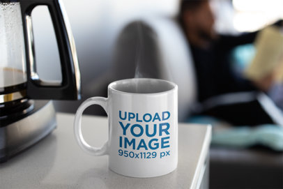 Mockup of a Coffee Mug Next to a Coffee Machine