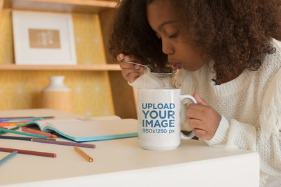 Mug Mockup of a Little Girl Drinking Tea with a Spoon 23906