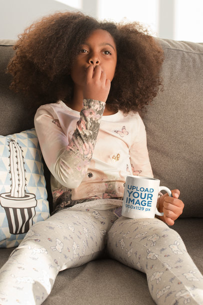 Mug Mockup of a Little Girl Sitting on a Couch 24012