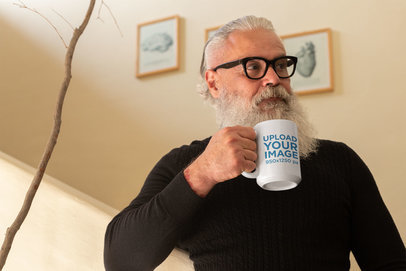 Mug Mockup of a Bearded Senior Having Tea at Home 23994