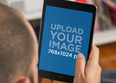 Mockup of a Young Man Lying on a Couch Using an iPad a5177wide