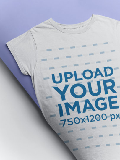 Mockup of a Tee Rolling into a Backdrop Paper Roll 24350