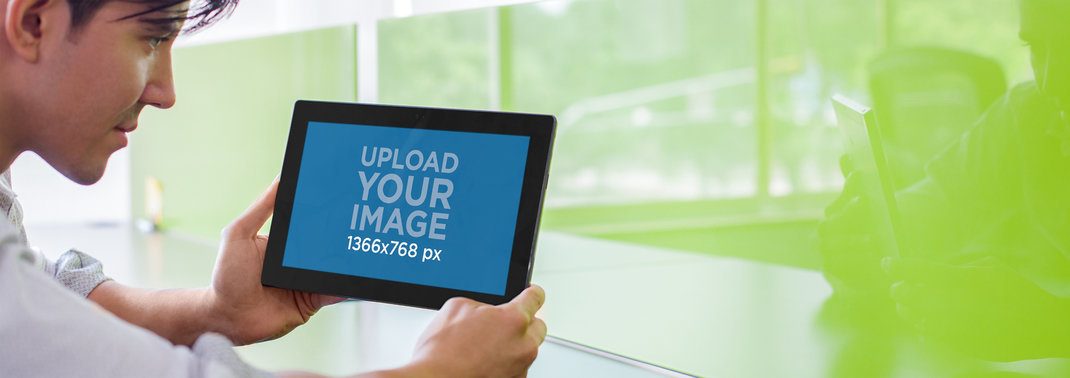 Tablet Mockup of a Young Man Using a Microsoft Surface