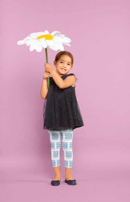 Leggings Mockup of a Little Girl Holding a Big Flower