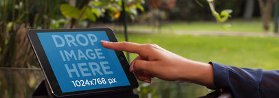 Tablet Mockup Featuring a Woman Using an iPad in her Backyard