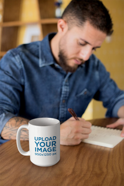 15 oz Mug Mockup of a Handsome Man Writing in His Journal