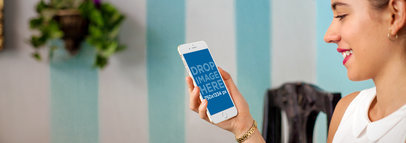 Woman Using iPhone 6 in Front of a Striped Painted Wall Mockup a4906