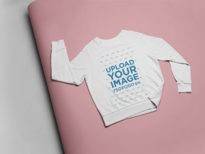 Flat Lay Mockup of a Crewneck Sweatshirt Over a Paper Backdrop