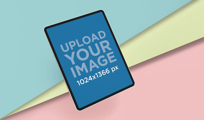 Render Mockup of an iPad Pro Floating Over Three Cardboard Sheets 24464