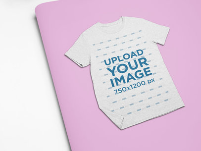 Mockup of a Heathered Tee Lying Over Two Cardboards