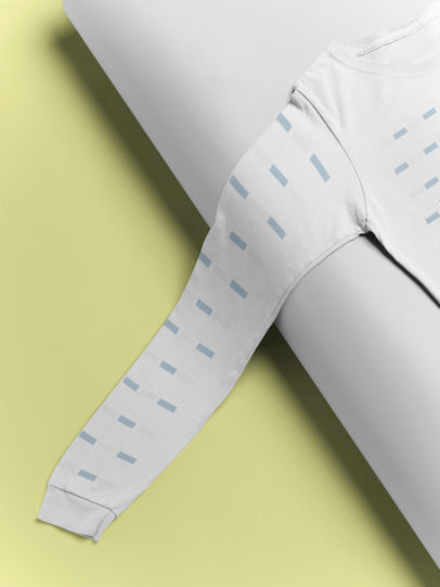 Mockup of a Long Sleeve Tee Lying Over a Paper Background 24359