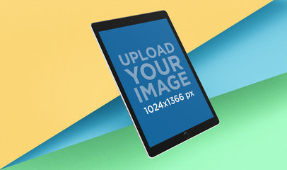 Mockup of an iPad Pro Surrounded by Colorful Pasteboard Cards 24477