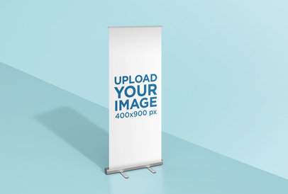 Mockup of a Roll-Up Banner Standing in a Colored Room 24508