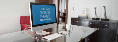 Mockup of an iMac on Top of a Glass Desk
