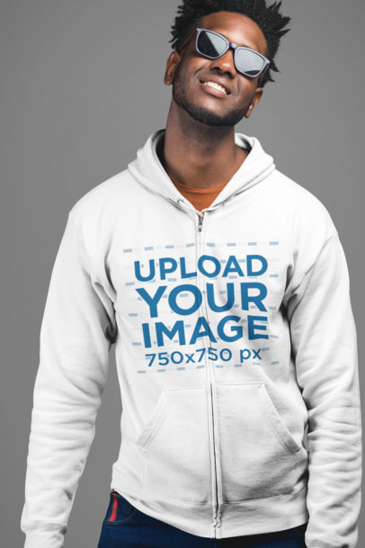 Mockup of a Trendy Man Wearing a Zip Up Hoodie in a Studio