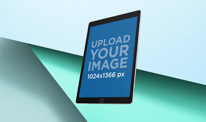 Colorful Mockup of an iPad Pro Floating over Pasteboard Cards 24484a