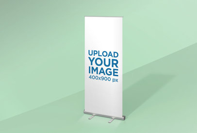 Mockup of a Roll-Up Banner Standing in a Space with One Color 24511
