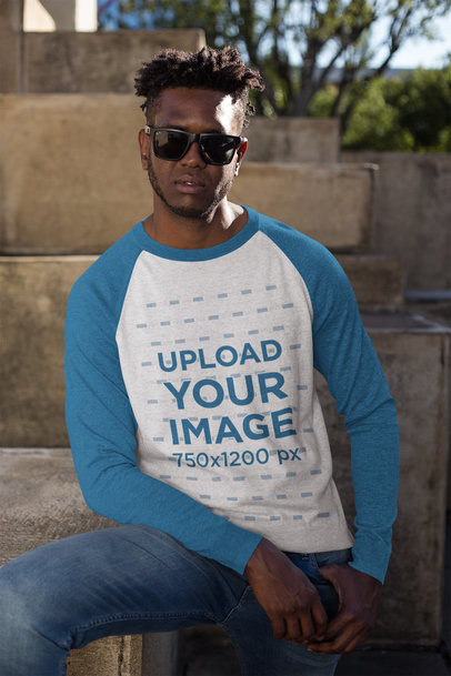Mockup of a Serious Man Wearing a Heathered Raglan Long Sleeve Tee