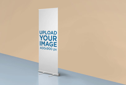 Mockup of a Roll-Up Banner Standing in a Room with Two Colors 24513
