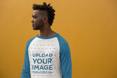 Mockup of a Handsome Man Wearing a Heathered Raglan Long Sleeve Tee
