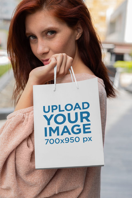 Gift Bag Mockup Featuring a Woman with Red Hair
