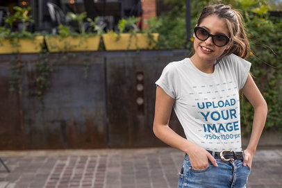 T-Shirt Mockup Featuring a Thin Woman with Glasses