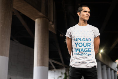 T-Shirt Mockup Featuring a Man Under a Bridge