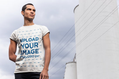 Mockup of a Man Wearing a Tee on a Cloudy Day
