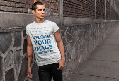 Tee Mockup Featuring a Cool Man With a Forearm Tattoo 24525