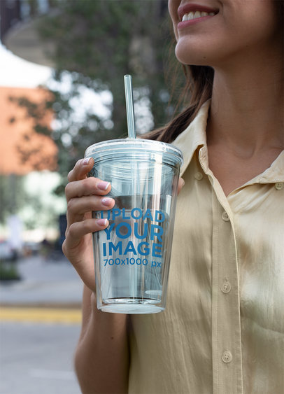 Tumbler Mockup Featuring a Woman Out and About 24414