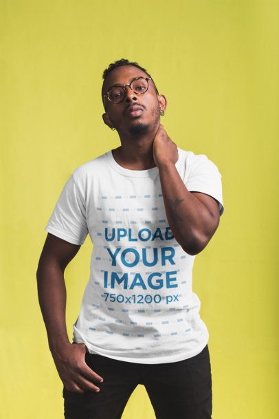 T-Shirt Mockup Featuring a Man Standing at a Photographic Studio 21054