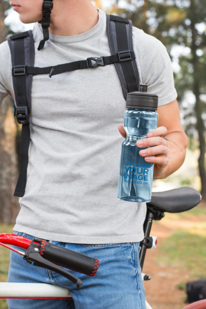 Sports Bottle Mockup Featuring a Man on a Mountain Bike