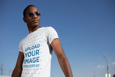 T-Shirt Mockup with a Man Striking a Pose