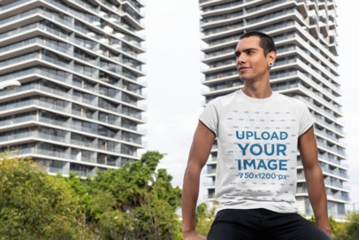 T-Shirt Mockup of a Smiling Man in the City