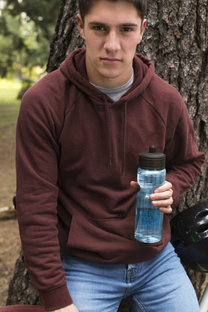 Mockup of a Handsome Man Holding His Water Bottle