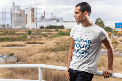 Tee Mockup of a Man with a Coy Smile Looking Towards the Horizon 24528
